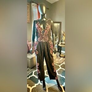 Free People Black and Red Ornate Jumpsuit with Deep V-neckline